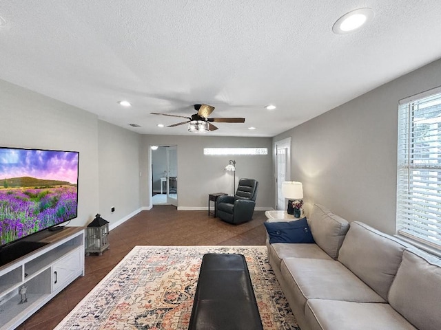 10011 46th Ave W, Bradenton, FL 34210 - living area featuring ceiling fan, recessed lighting, a textured ceiling, and baseboards