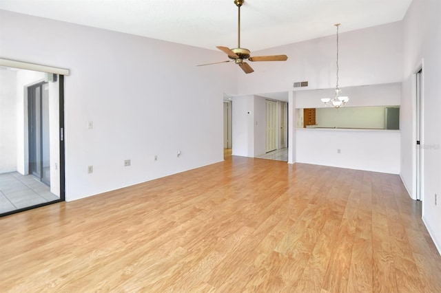 2593 Countryside Blvd Unit 7305, Clearwater, FL 33761 - unfurnished living room with a chandelier, ceiling fan, and light wood-style flooring