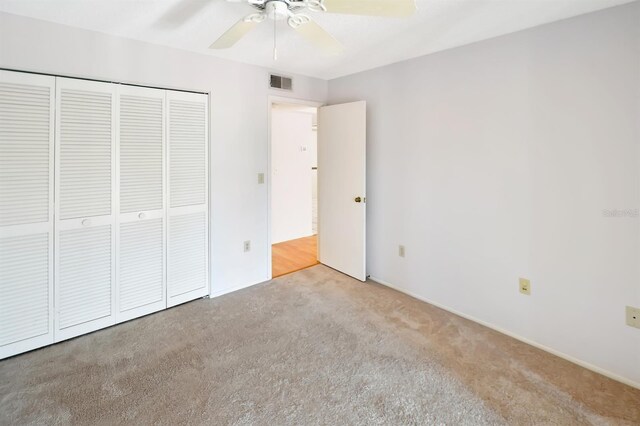 2593 Countryside Blvd Unit 7305, Clearwater, FL 33761 - unfurnished bedroom featuring carpet, a closet, and ceiling fan