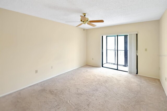 2593 Countryside Blvd Unit 7305, Clearwater, FL 33761 - carpeted spare room featuring a ceiling fan, baseboards, and a textured ceiling