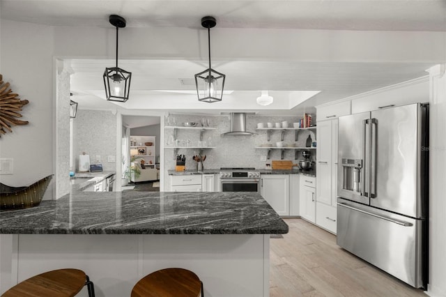 60 Lakeview Ct, Palm Harbor, FL 34683 - kitchen with high end appliances, open shelves, wall chimney exhaust hood, a peninsula, and white cabinetry