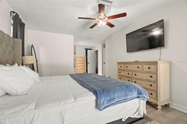 60 Lakeview Ct, Palm Harbor, FL 34683 - bedroom featuring baseboards, wood finished floors, and a ceiling fan