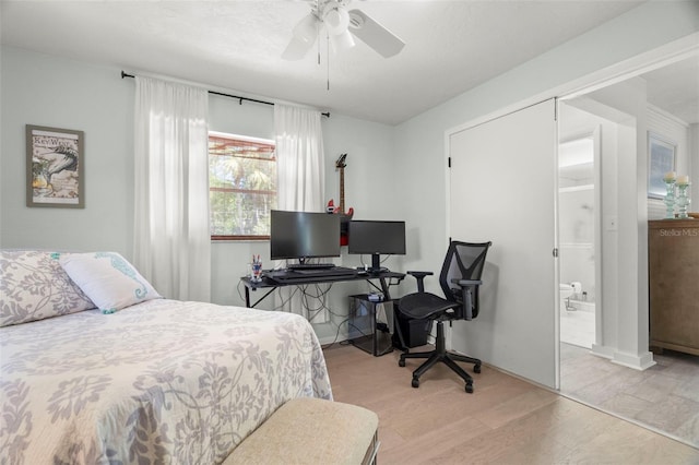 60 Lakeview Ct, Palm Harbor, FL 34683 - bedroom featuring light wood-style floors, a desk, ensuite bath, and a ceiling fan