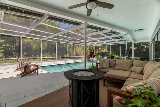 60 Lakeview Ct, Palm Harbor, FL 34683 - outdoor pool featuring an outdoor living space with a fire pit, a ceiling fan, a patio, and a lanai