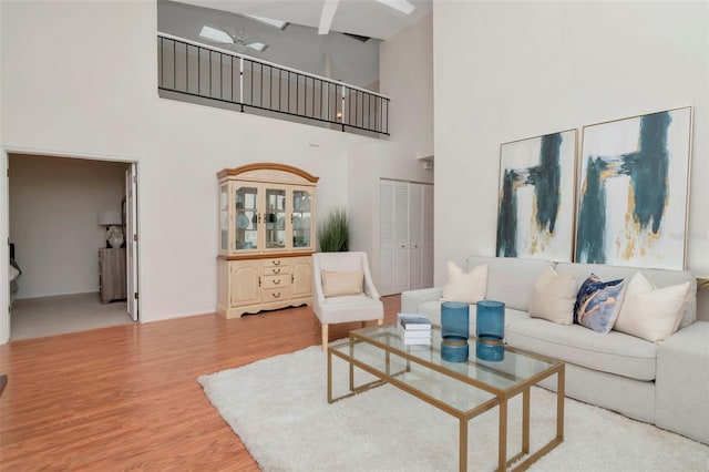 4234 Brentwood Park Cir, Tampa, FL 33624 - living room featuring a towering ceiling and wood finished floors