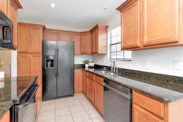 4234 Brentwood Park Cir, Tampa, FL 33624 - kitchen featuring black appliances, a sink, light tile patterned floors, dark stone counters, and recessed lighting