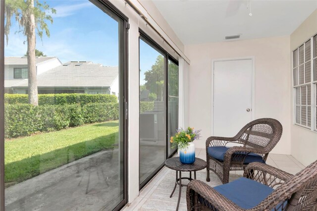 4234 Brentwood Park Cir, Tampa, FL 33624 - sunroom with tile patterned flooring