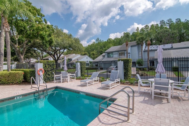 4234 Brentwood Park Cir, Tampa, FL 33624 - community pool with a patio area, a residential view, and outdoor dining space