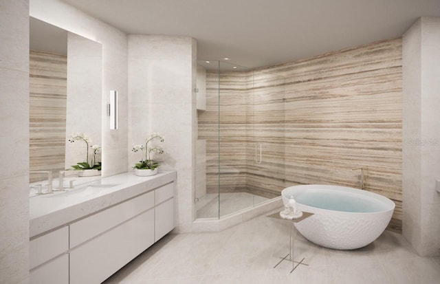 805 S Gulfview Blvd Unit 602A, Clearwater, FL 33767 - full bath with tile walls, vanity, a stall shower, a soaking tub, and tile patterned flooring