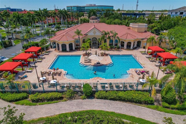 2773 Via Cipriani Unit 1310A, Clearwater, FL 33764 - community pool featuring a patio
