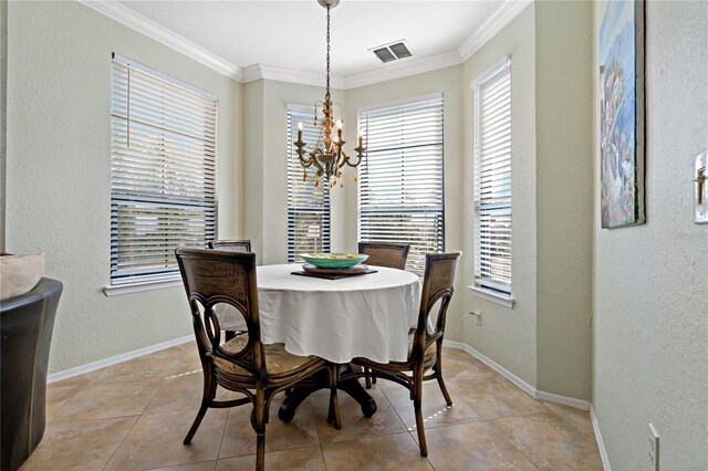 2773 Via Cipriani Unit 1310A, Clearwater, FL 33764 - dining area with a chandelier, crown molding, baseboards, light tile patterned flooring, and a textured wall