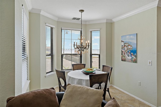 2773 Via Cipriani Unit 1310A, Clearwater, FL 33764 - dining space with a chandelier, crown molding, baseboards, and light tile patterned floors