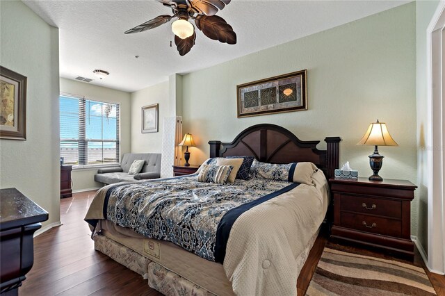 2773 Via Cipriani Unit 1310A, Clearwater, FL 33764 - bedroom with baseboards, wood finished floors, and a ceiling fan