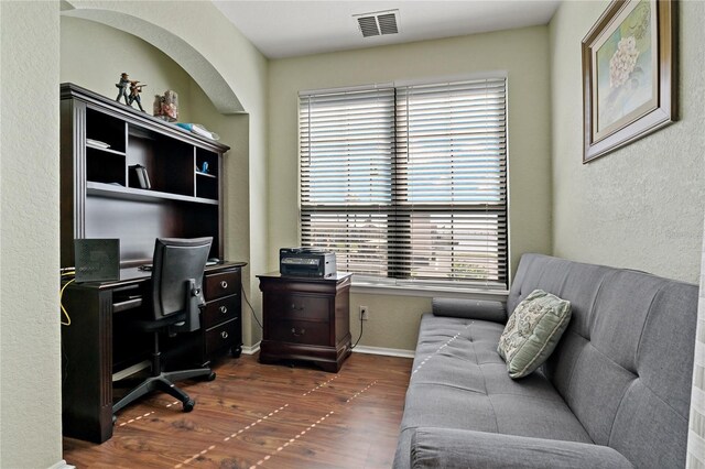 2773 Via Cipriani Unit 1310A, Clearwater, FL 33764 - home office with dark wood finished floors, baseboards, and a textured wall