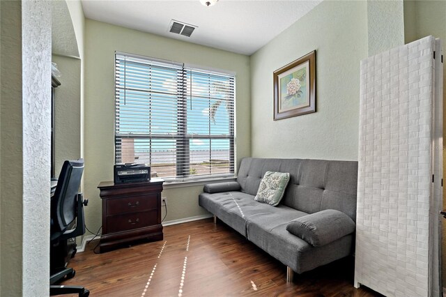 2773 Via Cipriani Unit 1310A, Clearwater, FL 33764 - office area with wood finished floors, a textured wall, and baseboards