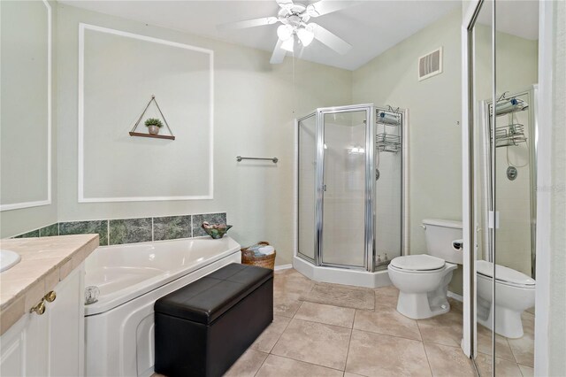2773 Via Cipriani Unit 1310A, Clearwater, FL 33764 - full bath with toilet, a stall shower, a ceiling fan, and tile patterned flooring