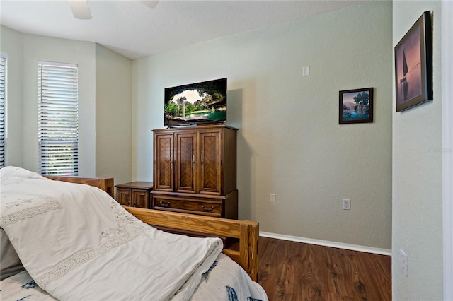 2773 Via Cipriani Unit 1310A, Clearwater, FL 33764 - bedroom with wood finished floors, baseboards, and a ceiling fan