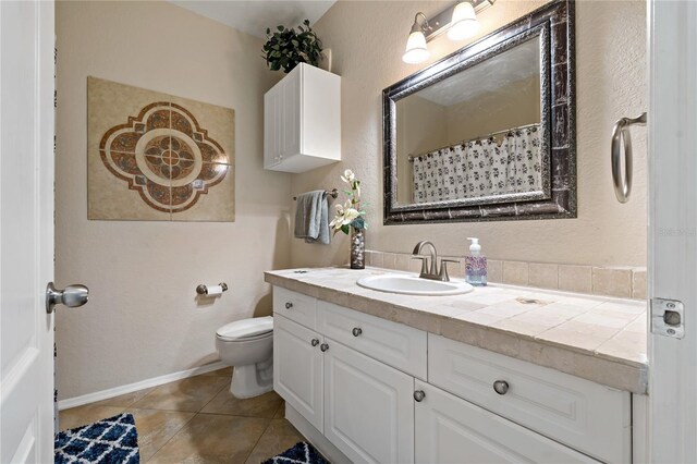 2773 Via Cipriani Unit 1310A, Clearwater, FL 33764 - full bathroom with toilet, vanity, and tile patterned flooring