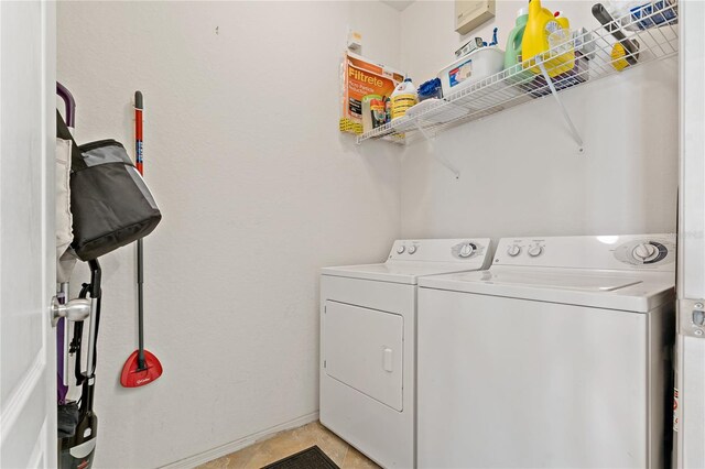 2773 Via Cipriani Unit 1310A, Clearwater, FL 33764 - washroom with separate washer and dryer and light tile patterned floors