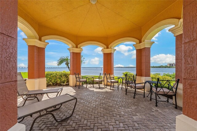 2773 Via Cipriani Unit 1310A, Clearwater, FL 33764 - view of patio with a water view
