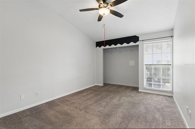 16109 Rambling Vine Dr E, Tampa, FL 33624 - unfurnished room with carpet flooring, a textured ceiling, ceiling fan, and baseboards