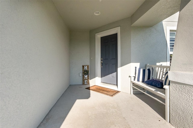 6050 Eagle Pointe Dr, Lakeland, FL 33812 - property entrance featuring stucco siding and a balcony