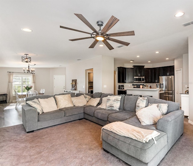 6050 Eagle Pointe Dr, Lakeland, FL 33812 - living area featuring recessed lighting, light carpet, ceiling fan, and a chandelier