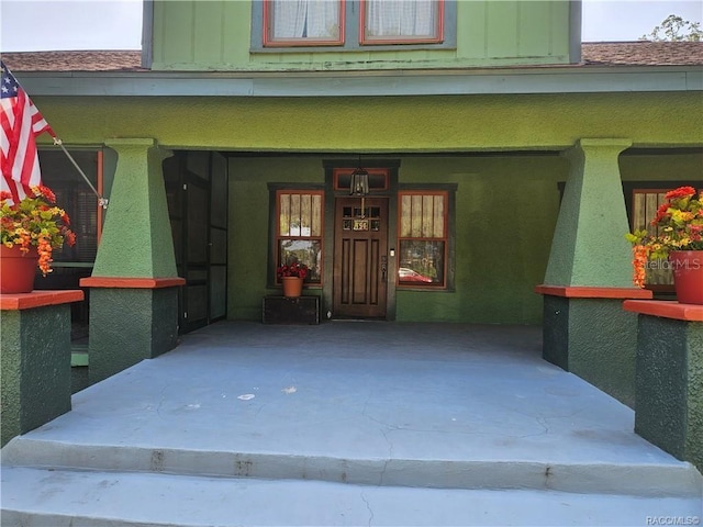 754 NE 2nd Ave, Crystal River, FL 34428 - doorway to property with covered porch