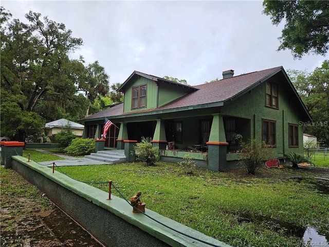 754 NE 2nd Ave, Crystal River, FL 34428 - view of front facade with covered porch and a chimney