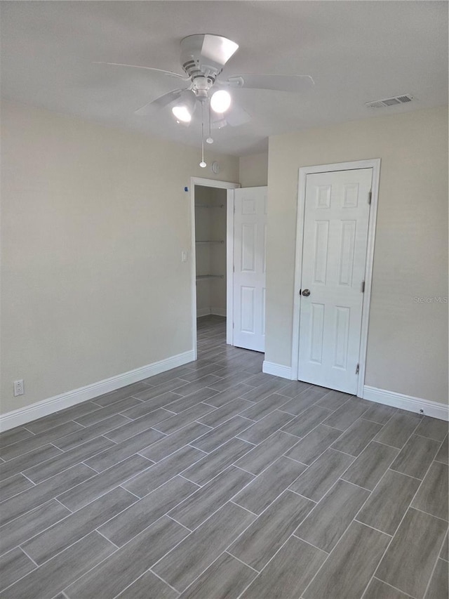 4611 17th Ave N, Saint Petersburg, FL 33713 - spare room with baseboards, a ceiling fan, and wood finished floors