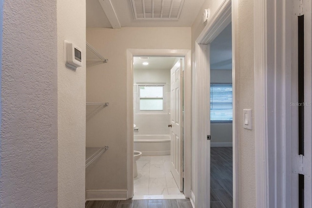 4611 17th Ave N, Saint Petersburg, FL 33713 - corridor with a textured wall and marble look tiles