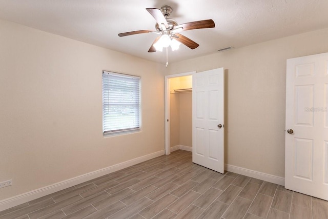 4611 17th Ave N, Saint Petersburg, FL 33713 - unfurnished bedroom featuring light wood finished floors, a ceiling fan, and a closet