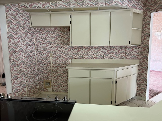 8130 Shalom Dr, Spring Hill, FL 34606 - laundry room featuring wallpapered walls and light tile patterned floors