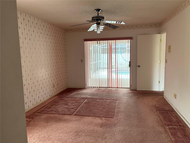 8130 Shalom Dr, Spring Hill, FL 34606 - carpeted spare room featuring a ceiling fan, wallpapered walls, a textured ceiling, and baseboards