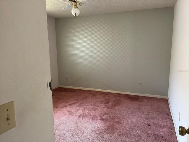 8130 Shalom Dr, Spring Hill, FL 34606 - spare room with carpet floors, a ceiling fan, a textured ceiling, and baseboards