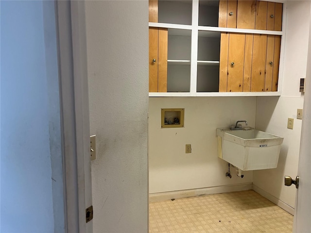 8130 Shalom Dr, Spring Hill, FL 34606 - washroom with cabinet space, tile patterned floors, hookup for a washing machine, and baseboards