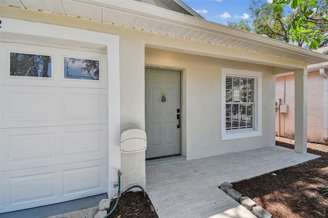2742 Wilson Ct, Palm Harbor, FL 34684 - entrance to property featuring stucco siding and a garage