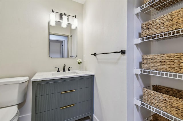 2742 Wilson Ct, Palm Harbor, FL 34684 - bathroom with toilet and vanity
