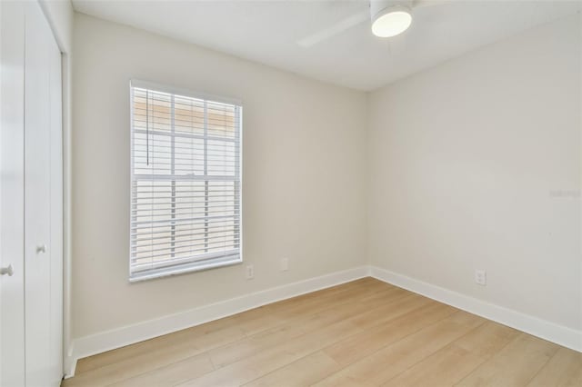 2742 Wilson Ct, Palm Harbor, FL 34684 - empty room with baseboards, light wood-type flooring, and a ceiling fan