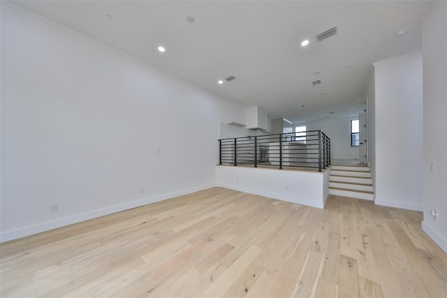 1801 N Morgan St Unit 5, Tampa, FL 33602 - unfurnished living room with ornamental molding, light wood-type flooring, baseboards, recessed lighting, and stairs