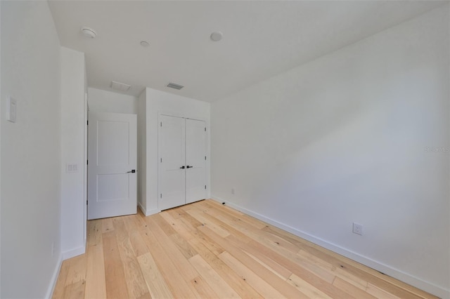 1801 N Morgan St Unit 5, Tampa, FL 33602 - unfurnished bedroom featuring light wood-style floors, baseboards, and a closet