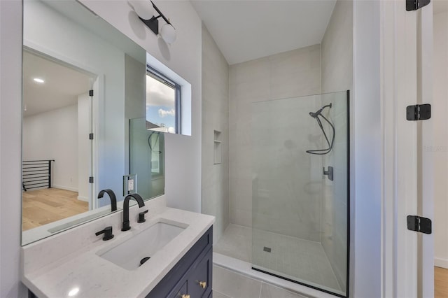 1801 N Morgan St Unit 5, Tampa, FL 33602 - bathroom featuring a shower stall, vanity, and wood finished floors