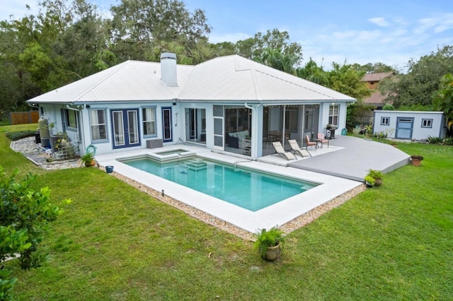 8701 Lake Calm Ln, Odessa, FL 33556 - rear view of property with a patio, a lawn, a chimney, an outbuilding, and a pool with connected hot tub