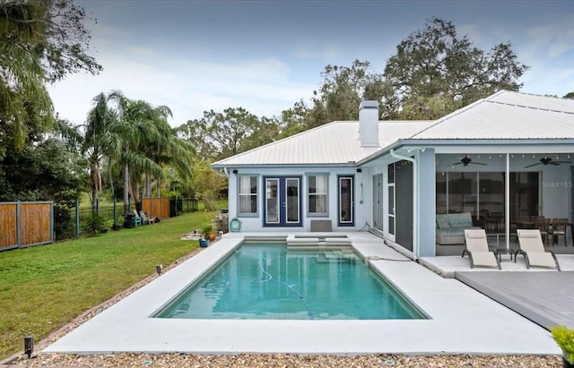 8701 Lake Calm Ln, Odessa, FL 33556 - rear view of house featuring a ceiling fan, a chimney, metal roof, and a patio