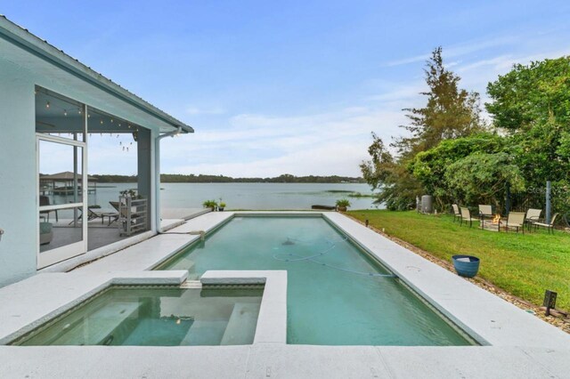 8701 Lake Calm Ln, Odessa, FL 33556 - view of pool with a water view, a yard, a pool with connected hot tub, and a sunroom