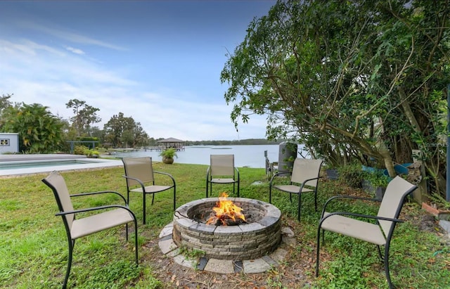 8701 Lake Calm Ln, Odessa, FL 33556 - view of grassy yard with a fire pit and a water view
