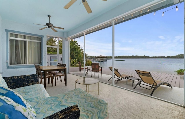 8701 Lake Calm Ln, Odessa, FL 33556 - sunroom featuring a ceiling fan, a water view, and outdoor dining space