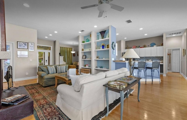 8701 Lake Calm Ln, Odessa, FL 33556 - living room featuring ceiling fan, light wood-type flooring, baseboards, and recessed lighting