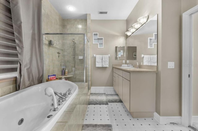 8701 Lake Calm Ln, Odessa, FL 33556 - full bath featuring vanity, a whirlpool tub, baseboards, and a stall shower
