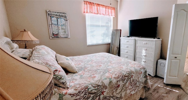 834 Tremont Greens Ln Unit 137, Sun City Center, FL 33573 - bedroom featuring wood finished floors